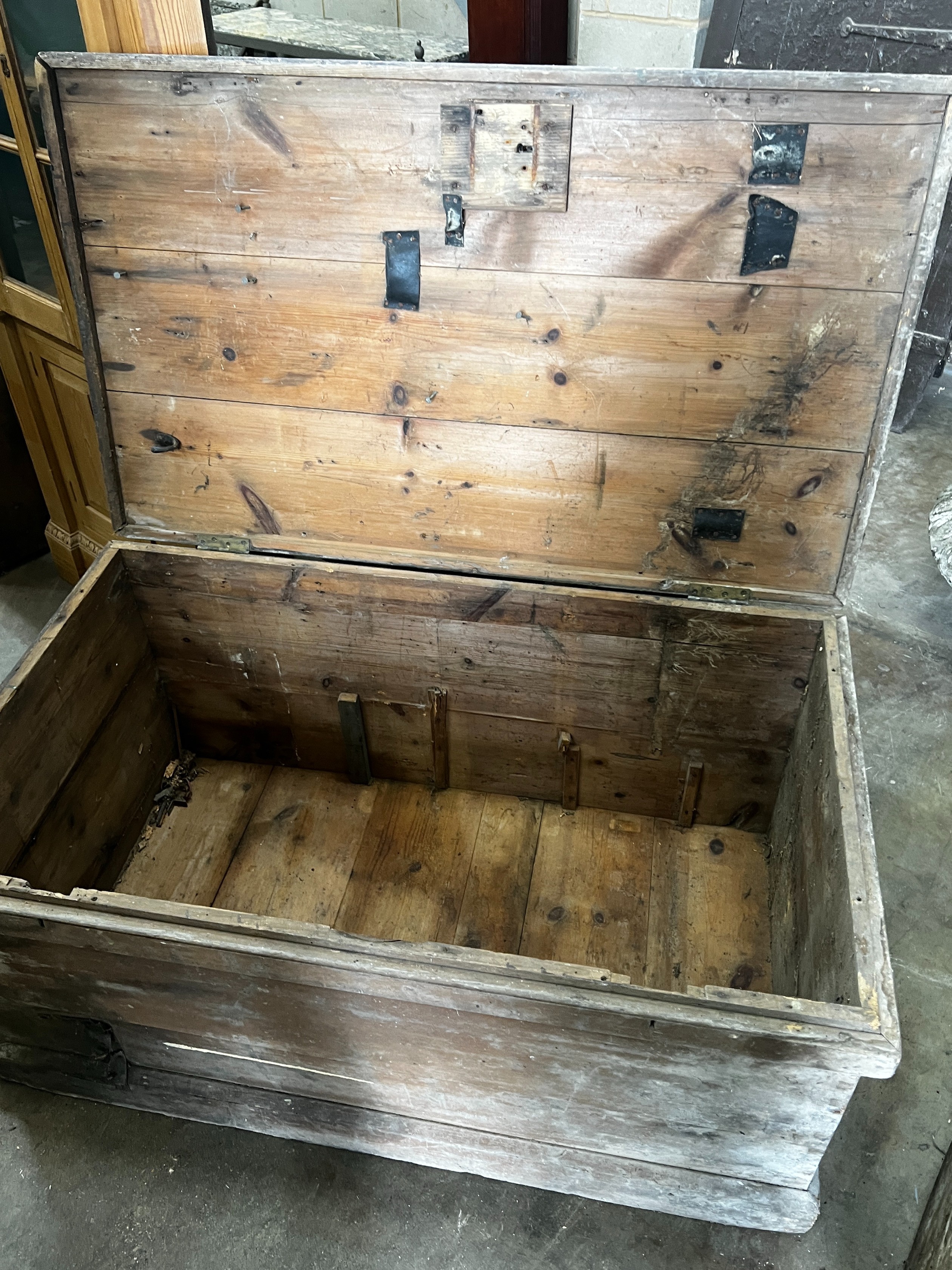 A large Victorian rectangular pine trunk, width 120cm depth 69cm height 53cm